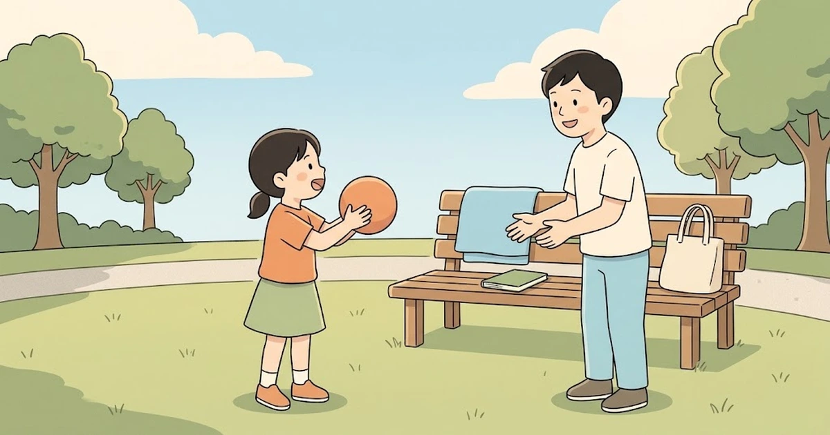 公園でキャッチボールをしながら、英語の言葉を言い合う小学生と保護者