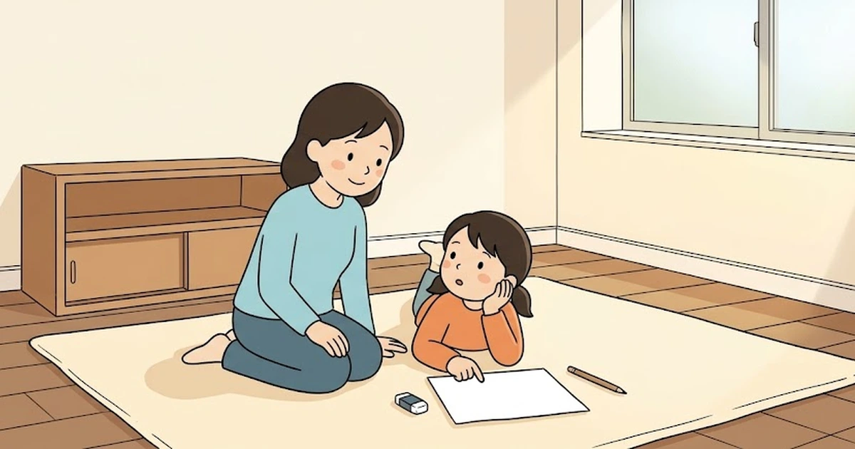 子ども部屋のラグに腹ばいになり、紙に指を当てて、つまずいたところを母親に話す小学生